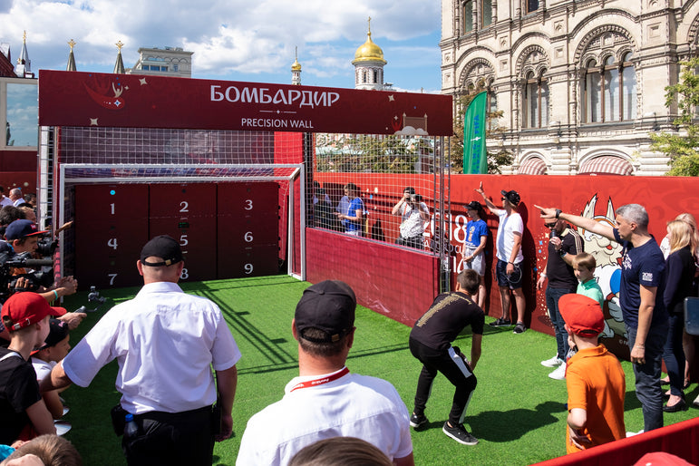 crowd playing football with acura elite esa precision wall 9 panel with red branding for russia world cup