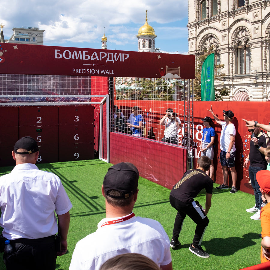 crowd playing football with acura elite esa precision wall 9 panel with red branding for russia world cup