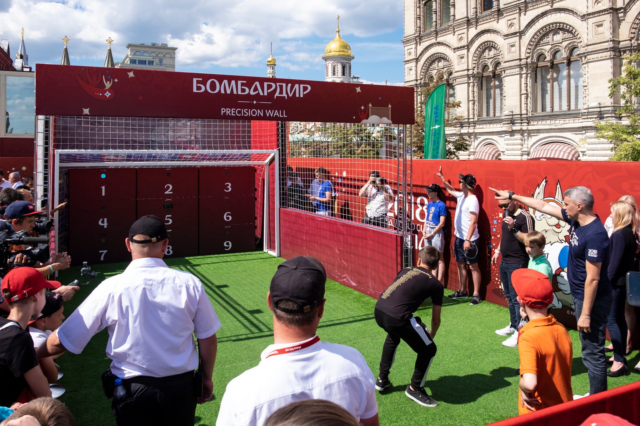 crowd playing football with acura elite esa precision wall 9 panel with red branding for russia world cup
