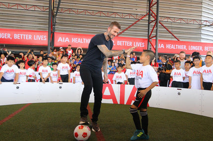 David beckham hi fiving child while using Acura Elite ICON Arena
