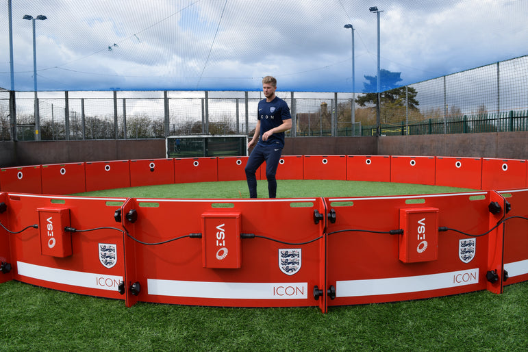 Man training inside england branded acura elite icon arena 8m