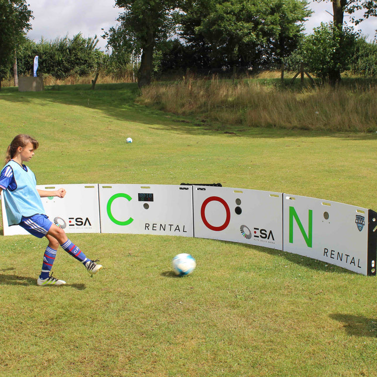 Child playing soccer on a grass field with acura elite ICON Q