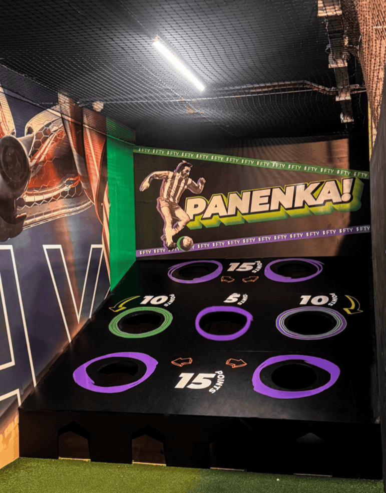 indoor acura elite panenka with purple and green targets and black background