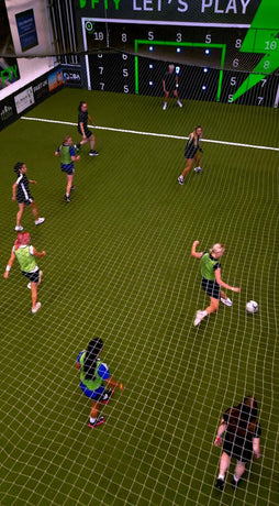 Thumbnail for video of girls playing football inside facility with acura elite 28 panel precision wall
