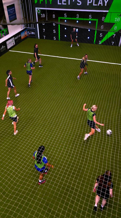 Thumbnail for video of girls playing football inside facility with acura elite 28 panel precision wall