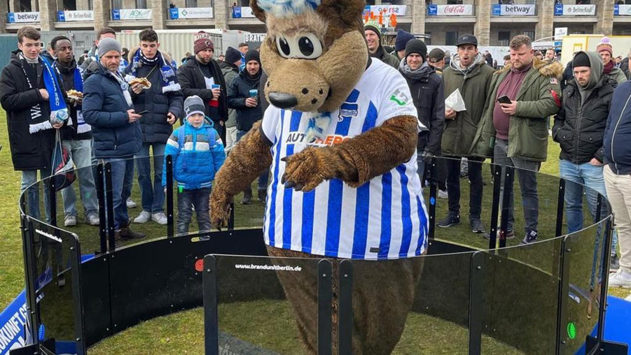 bear mascot using acura elite icon fast feet with crowd watching