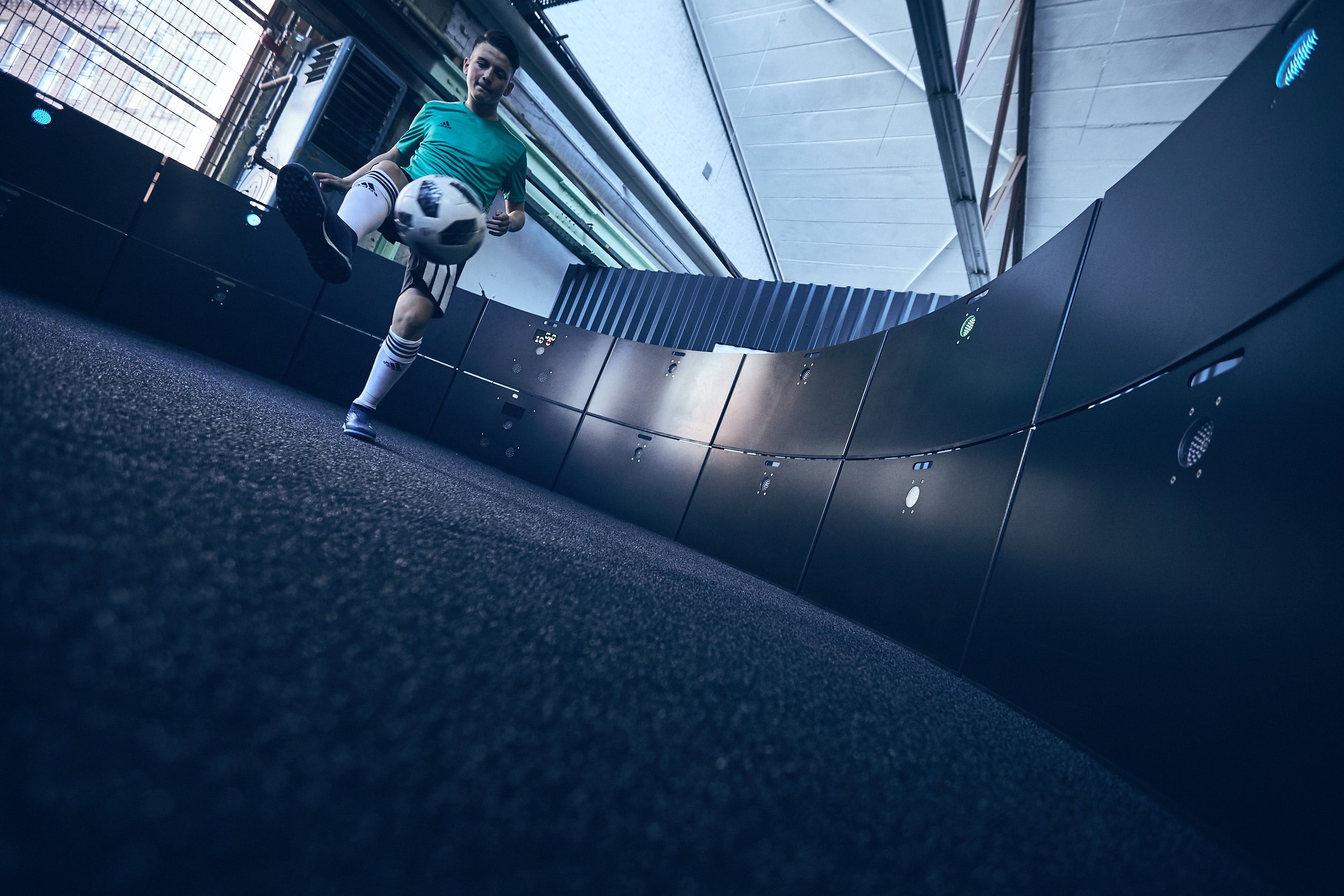 man kicking ball at stacked acura icon arena 6m 16-panel