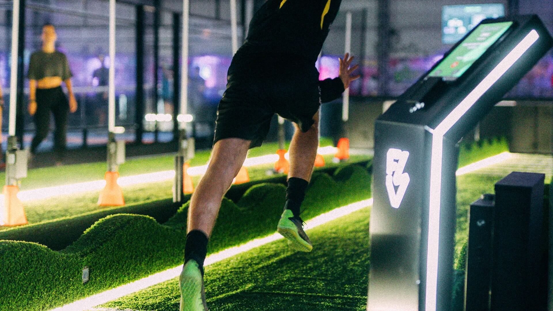 man sprinting inside using acura elite training lane (sprint)
