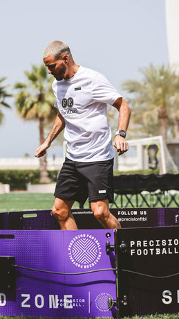 Person in a purple branded icon arena 4m with palm trees and clear sky in the background