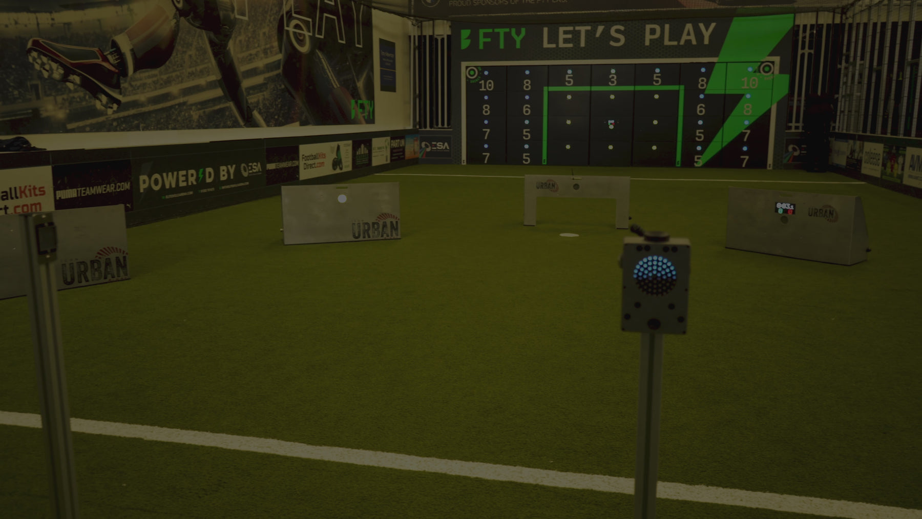 video of man demonstrating how vision sequence game mode works on acura elite esa wireless circuit inside training facility with astro turf