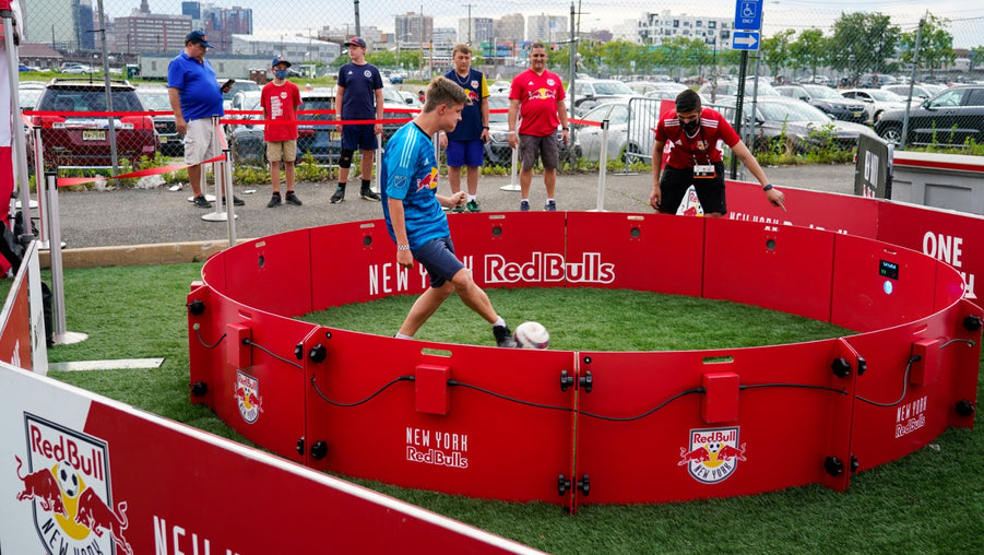 People playing football with acura red bull branded acura icon 4m 12-panel arena