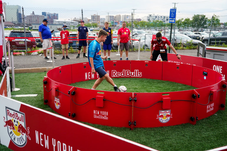 People playing football with acura red bull branded acura icon 4m 12-panel arena