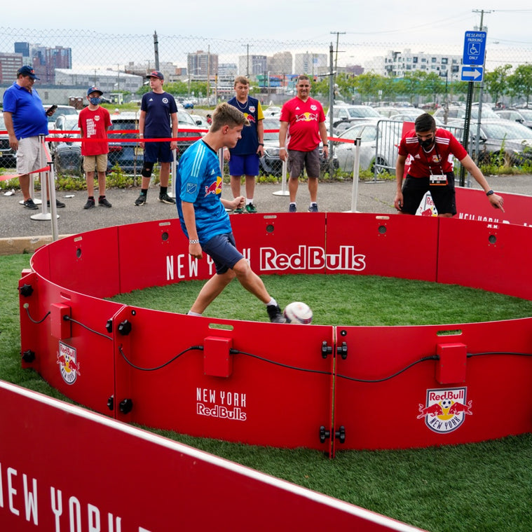 People playing football with acura red bull branded acura icon 4m 12-panel arena